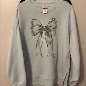 Light Blue Sweatshirt with Pearl Bow Design